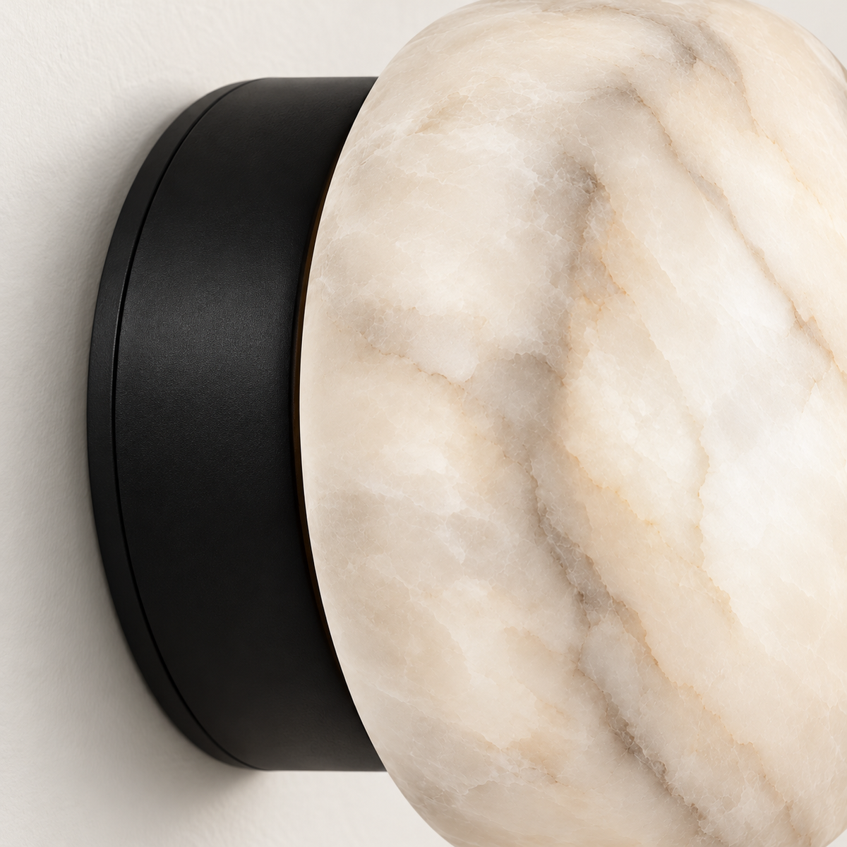 Olmo Alabaster Pebble Wall Light, black finish, studio photo